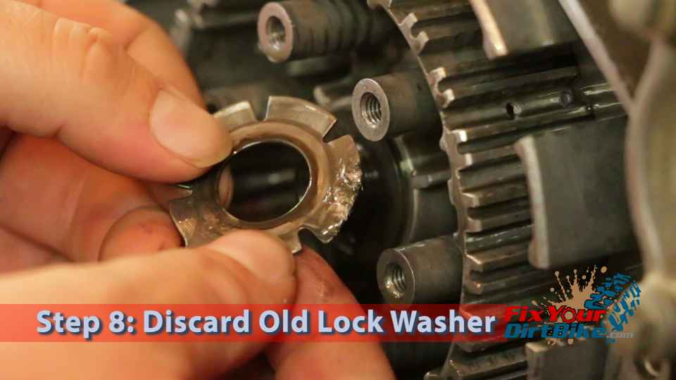 Step 8: Remove and discard the lock washer.