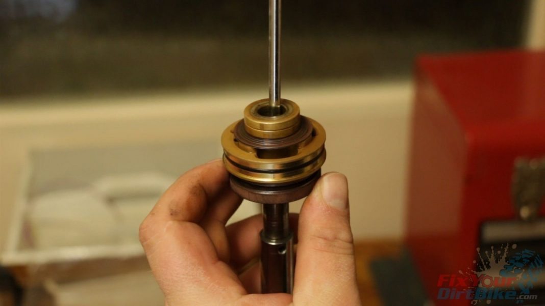Step 7: Transfer the valve stack to a screwdriver to keep everything organized.