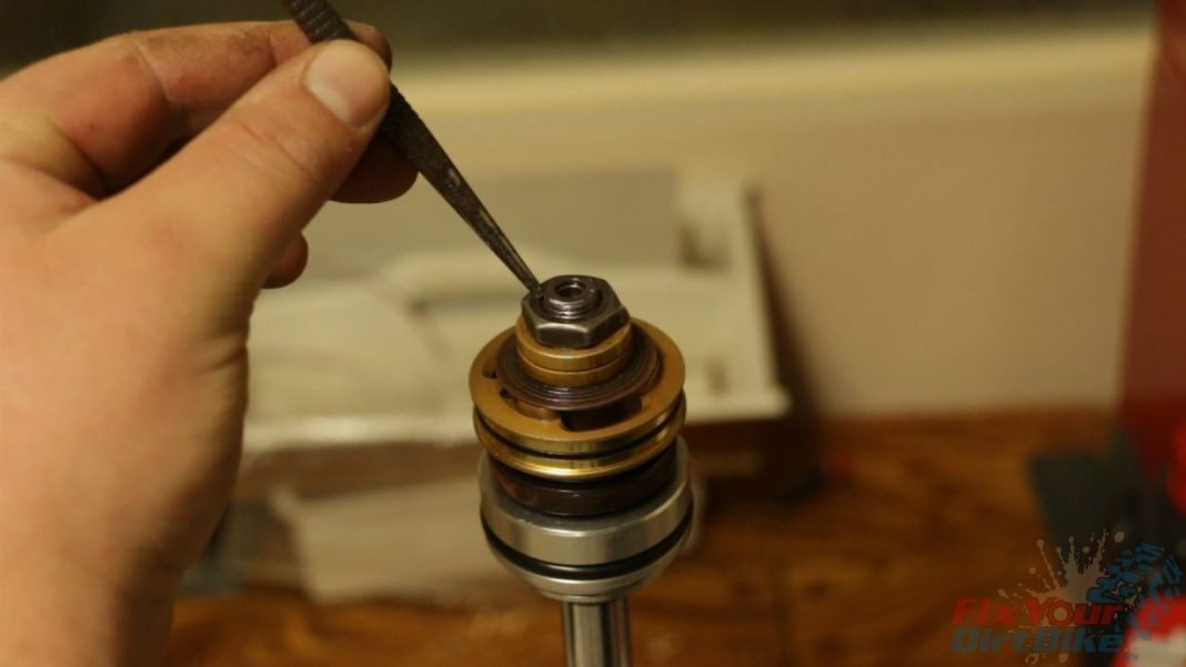Step 15: After you torque the shaft nut, use a punch and hammer to seal the threads.