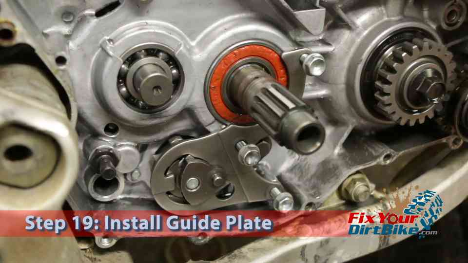 : Carefully install the guide plate and drum shifter assembly. Hold the guide plate in place as you thread the retaining bolts. Torque the guide plate retaining bolts (88in.lb)