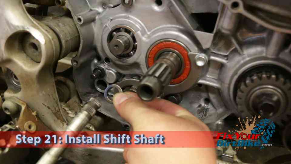 Step 21: Install the washer in the shift shaft then install the shift shaft into the crankcase.