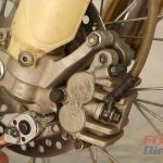 Step 1 – Unbolt the brake caliper from the fork
