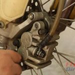 Step 11 – Install the brake caliper.
