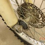 Step 12 – Take your bike off the stand and compress the front forks several times.