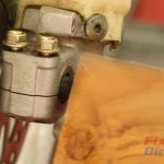 Step 4 – Use your block of wood to knock the axle out of the mounts.