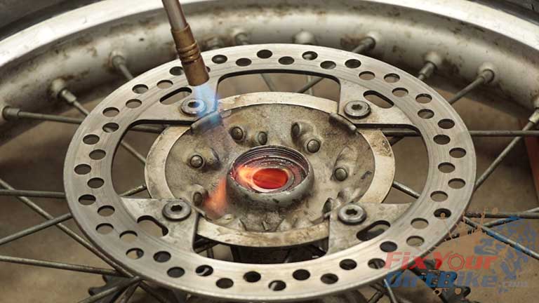 Step 8: Heat the hub, not the bearing, for 60 seconds. This makes the hub expand slightly, which relieves the pressure on the bearing.