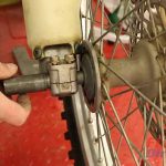 Step 8 – Align your wheel hub with the fork and install the axle.
