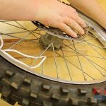 Step 8 – Pry Tire Over Rim