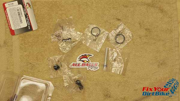 I am installing an All Balls rebuild kit that includes a new set of banjo bolt seal washers, dust seal, piston seal, pad pin, bleeder cap cover, and new boots. (Get Yours HERE)