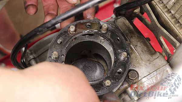 Set your cylinder head aside, and set the old gasket in the trash.