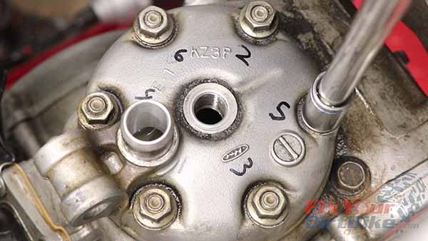 Loosen the cylinder head nuts ¼ turn at a time to avoid head warp, with as many passes as you need.