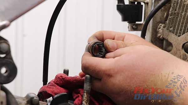 Remove the needle bearing, and wrap your connecting rod with a clean shop towel.