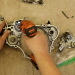 2 – Start by removing the two screws holding the governor fork to the push rod assembly