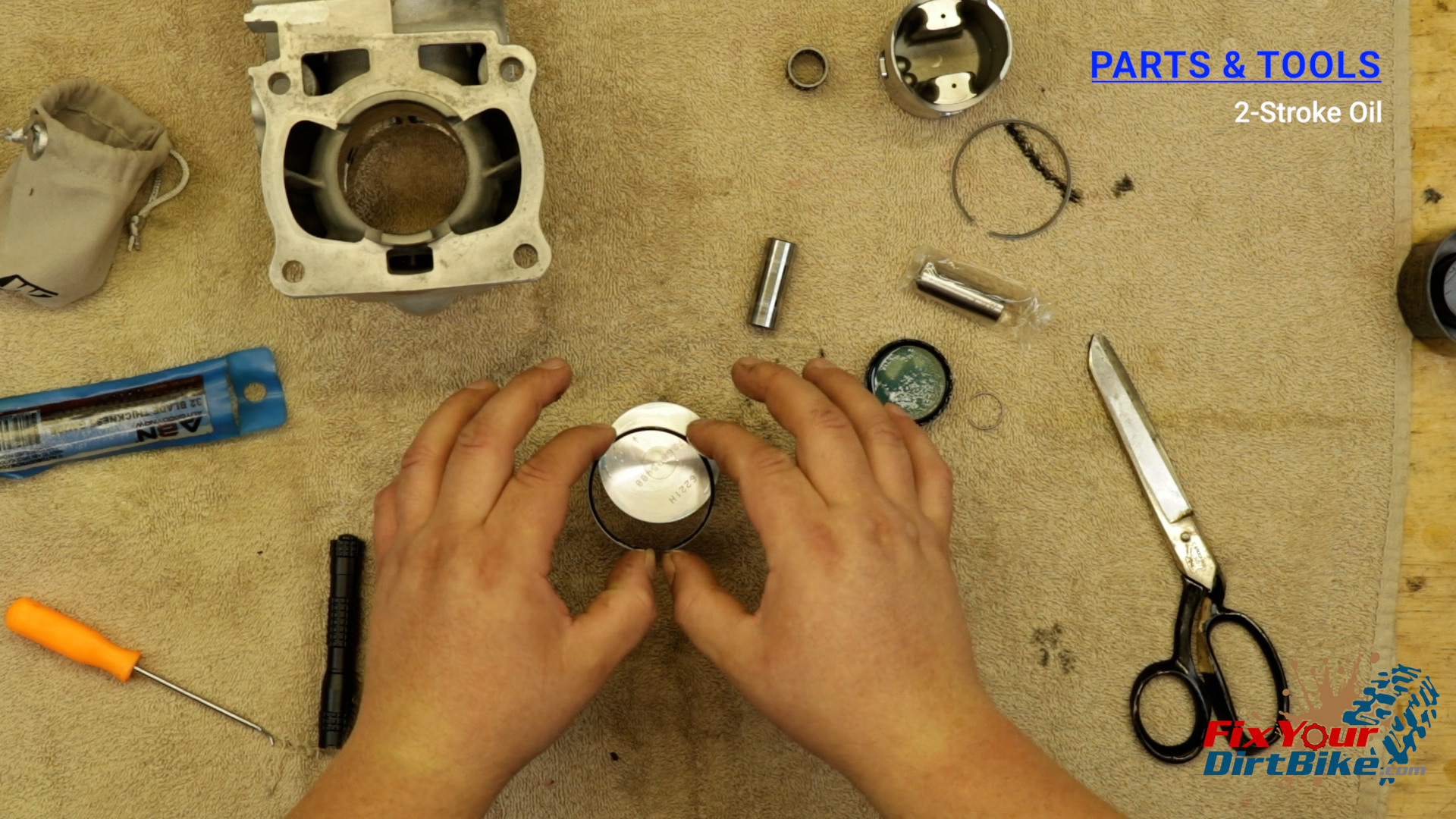 9 - Lubricate the piston edge and ring grooves with 2-stroke oil.