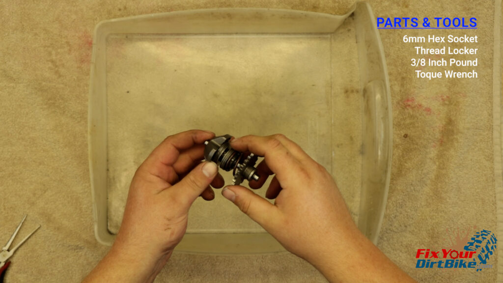 9 - The exhaust valve governor is a stack of thrust bearings, washers, and a collar, all held together with a single pin at the end