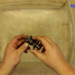 9 – The exhaust valve governor is a stack of thrust bearings, washers, and a collar, all held together with a single pin at the end